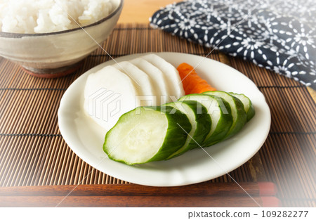 Cucumber, daikon radish, and carrot pickled in rice bran pickles and rice 109282277