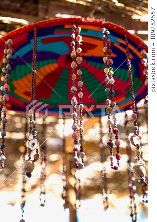Dreamcatcher in front of a cafe under a thatched roof 109282557