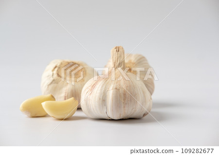 A large head of garlic on a white background A large head of garlic on a white background 109282677