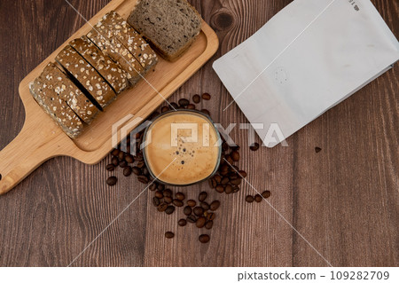 Top view, coffee cup, coffee flavored bread slices with coffee beans around 109282709