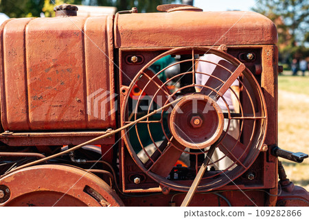 belt drive on an old vintage tractor. 109282866