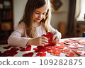 Kid making heart-shaped Valentine's card 109282875