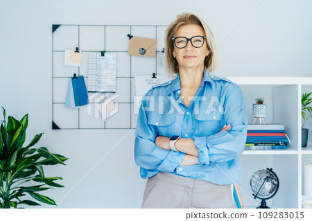 Portrait of smiling 50's stylish, confident mature businesswoman, middle aged company ceo director, experienced senior female professional, business coach team leader in modern office. Female leader 109283015