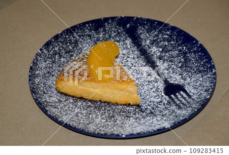 pumpkin casserole with cottage cheese and tangerines on a blue plate pumpkin casserole with cottage cheese and tangerines on a blue plate 109283415