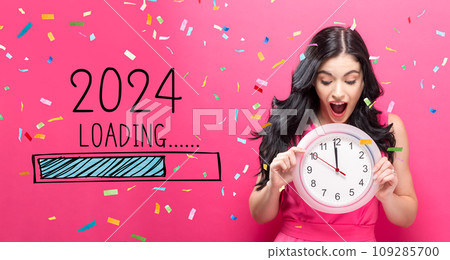 Loading new year 2024 with young woman holding a clock Loading new year 2024 with young woman holding a clock 109285700