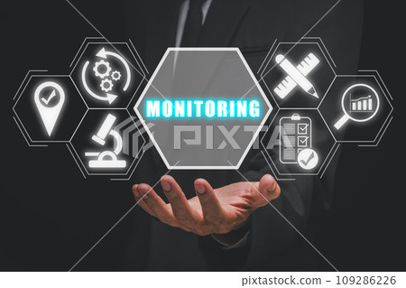 Monitoring concept, Businessman hand holding monitoring icon on virtual screen. 109286226