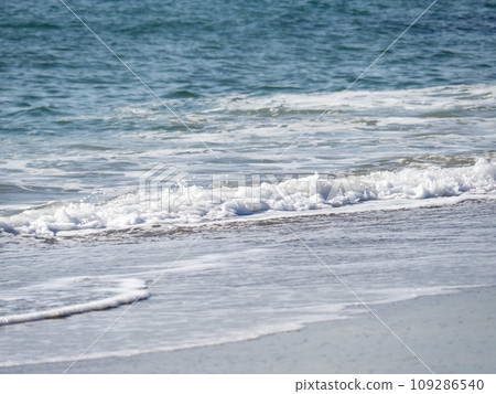 Waves on the sandy beach. Waves on the sandy beach. 109286540