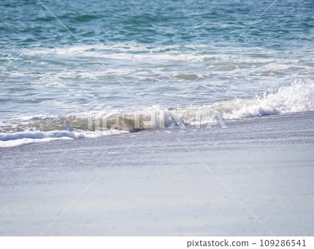 Waves on the sandy beach. Waves on the sandy beach. 109286541