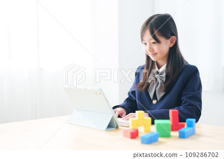 Girl studying programming with blocks 109286702