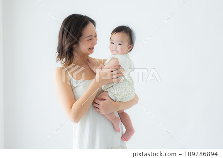 Woman holding a baby 109286894