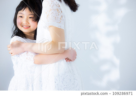 Girl hugging her mother 109286971