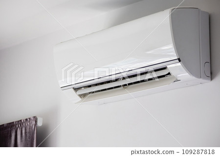Air conditioner on white wall room interior background Air conditioner on white wall room interior background 109287818