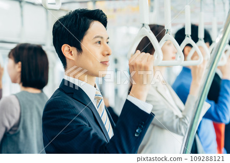 Businessman on a commuter train Photography cooperation: Keio Electric Railway Co., Ltd. 109288121