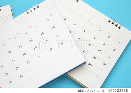 calendar page close up on blue background business planning appointment meeting concept 109288288