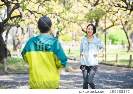 Runners passing each other, running Runners passing each other, running 109288375