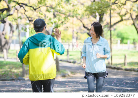 Runners passing each other, running Runners passing each other, running 109288377
