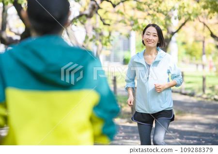 Runners passing each other, running Runners passing each other, running 109288379
