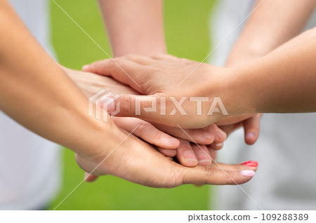 Friends, support and stack of hands of people for motivation, community and friendship outdoors 109288389