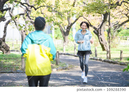 Runners passing each other, running Runners passing each other, running 109288390
