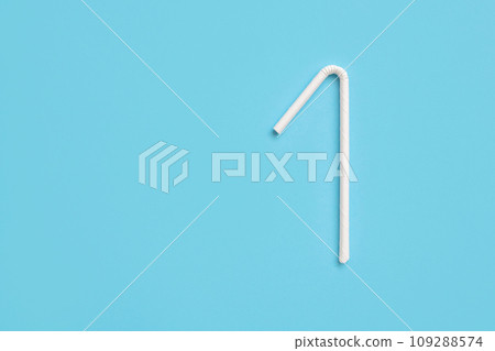 Biodegradable eco friendly white paper drinking straw on blue background Biodegradable eco friendly white paper drinking straw on blue background 109288574