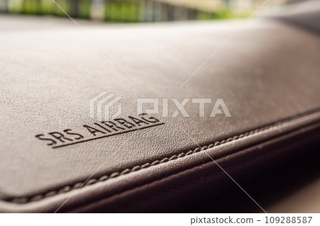 airbag safety sign on brown leather texture in modern car airbag safety sign on brown leather texture in modern car 109288587