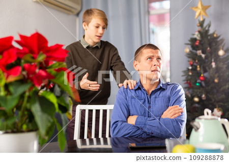 Man ignoring his son during Christmas weekend Man ignoring his son during Christmas weekend 109288878