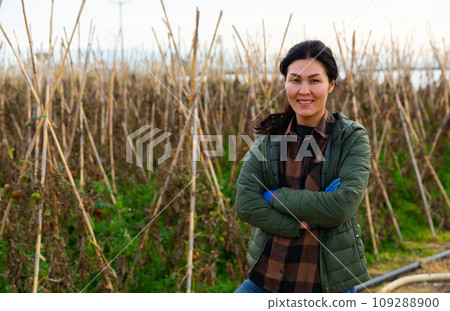 Smiling asian woman farmer posing at a farm 109288900