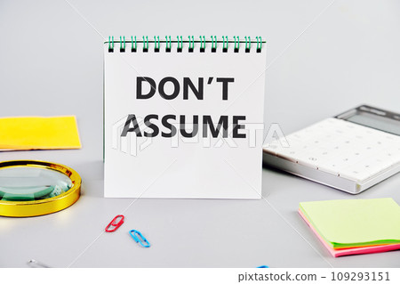 DO NOT ASSUME the inscription on the notebook on a gray background next to the stationery DO NOT ASSUME the inscription on the notebook on a gray background next to the stationery 109293151