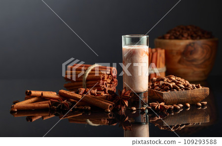 Coffee liquor with cream on a brown background. Coffee liquor with cream on a brown background. 109293588