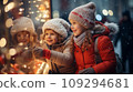 Two small children a boy and a girl on a snowy winter street are looking at a shop window 109294681