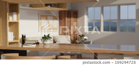 Copy space on a wooden tabletop with a potted plant and stationery on the table in a living room. 109294728