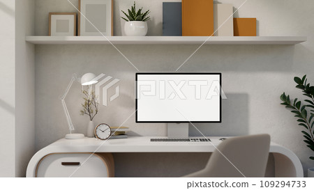 A white-screen PC computer mockup on a white desk in a modern trendy home office or private office. A white-screen PC computer mockup on a white desk in a modern trendy home office or private office. 109294733