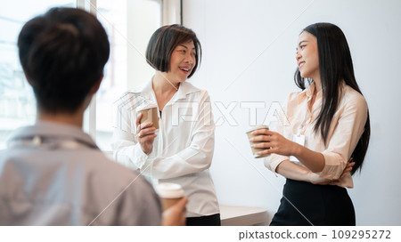 Group of friendly and happy diverse Asian businesspeople are enjoying chatting during a coffee break Group of friendly and happy diverse Asian businesspeople are enjoying chatting during a coffee break 109295272