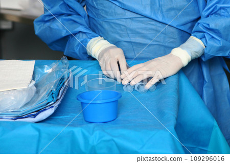Preparation for the operation. Modern surgery. The work of doctors in the operating room. Close-up of the hands. Preparation for the operation. Modern surgery. The work of doctors in the operating room. Close-up of the hands. 109296016