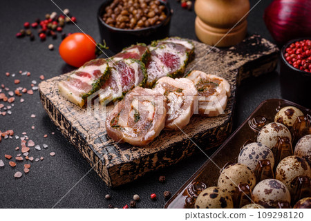 Raw quail eggs in a plastic box on a dark concrete background Raw quail eggs in a plastic box on a dark concrete background 109298120
