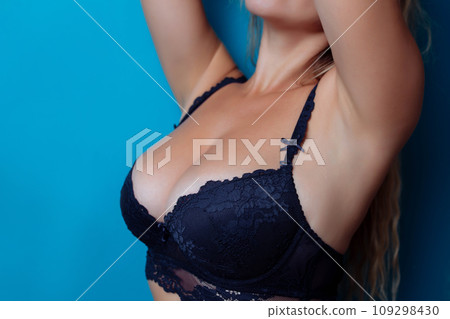 Close-up of sexy breasts in bra. Woman's breasts or big natural boobs in lingerie. Plastic surgery 109298430