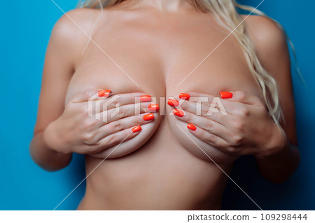 Big Breasts of a sexy woman, close up. Plastic correction and surgery concept. Big Breasts of a sexy woman, close up. Plastic correction and surgery concept. 109298444