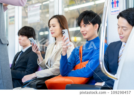 Young man on the train Photography cooperation "Keio Electric Railway Co., Ltd." Young man on the train Photography cooperation "Keio Electric Railway Co., Ltd." 109298457