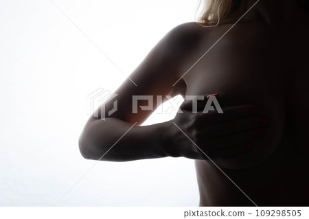 Big Breasts of a sexy woman, close up. Plastic correction and surgery concept. silhouette on a white background Big Breasts of a sexy woman, close up. Plastic correction and surgery concept. silhouette on a white background 109298505