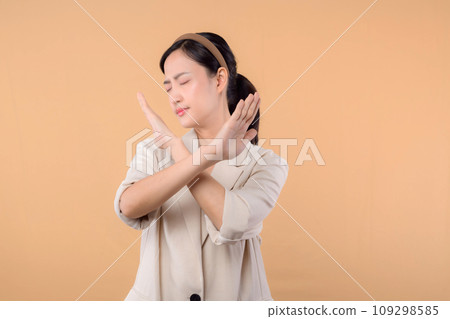 Studio portrait of happy successful confident young asian business woman. Beautiful young lady in white jacket smiling at camera standing isolated on solid beige colour copyspace background Studio portrait of happy successful confident young asian business woman. Beautiful young lady in white jacket smiling at camera standing isolated on solid beige colour copyspace background 109298585