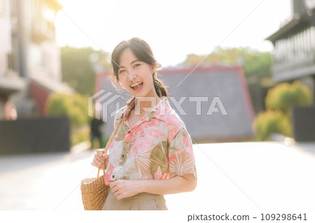 Portrait beautiful young asian woman on summer holiday vacation trip in Thailand. Young hipster female tourist sightseeing summer urban Bangkok destination. Asia summer tourism concept. Portrait beautiful young asian woman on summer holiday vacation trip in Thailand. Young hipster female tourist sightseeing summer urban Bangkok destination. Asia summer tourism concept. 109298641