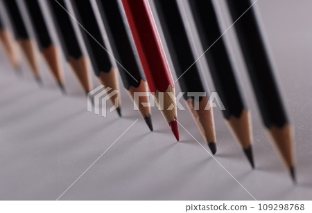 One red pencil is set of identical black counterparts 109298768