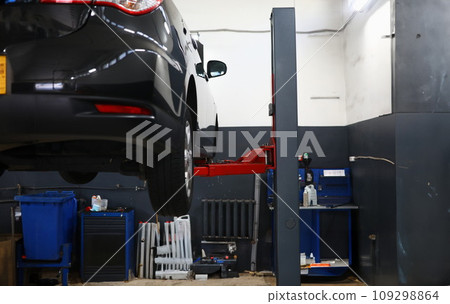 Modern car on lift in service center 109298864