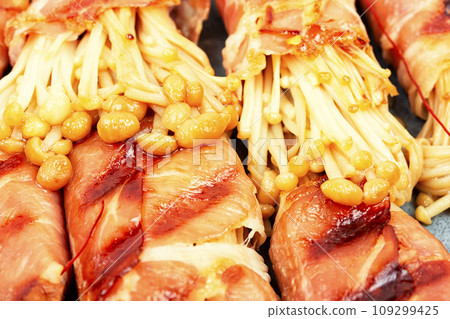 Enoki mushroom appetizer fried in bacon Enoki mushroom appetizer fried in bacon 109299425