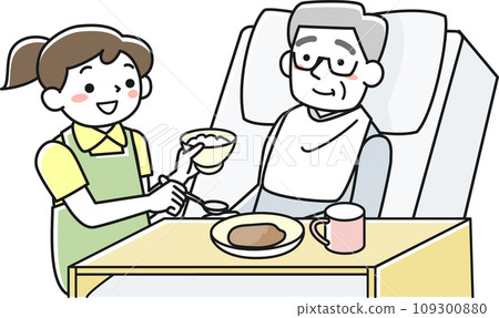 A senior man eating in bed and a female staff member assisting him 109300880