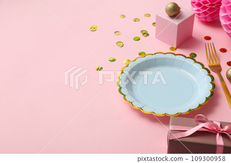 Plate, fork and gift boxes on pink background, space for text Plate, fork and gift boxes on pink background, space for text 109300958