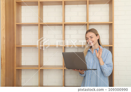 A young woman is working on a laptop 109300990