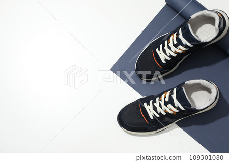Stylish sneakers with a white sole on a white background 109301080