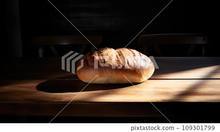 Advertising shot of cutted bread on a wooden table, product photography, play of light and shadow 109301799