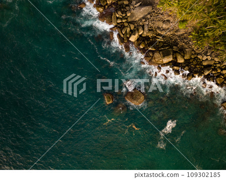 Aerial view of Waves crashing on seashore,Sea surface ocean waves background 109302185